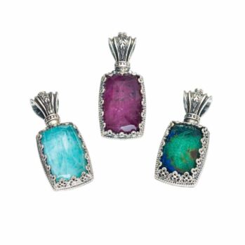 Pendant in sterling silver with doublet stone 10x15mm and a tiny garnet in the top.Aegean colors pendant in Sterling Silver