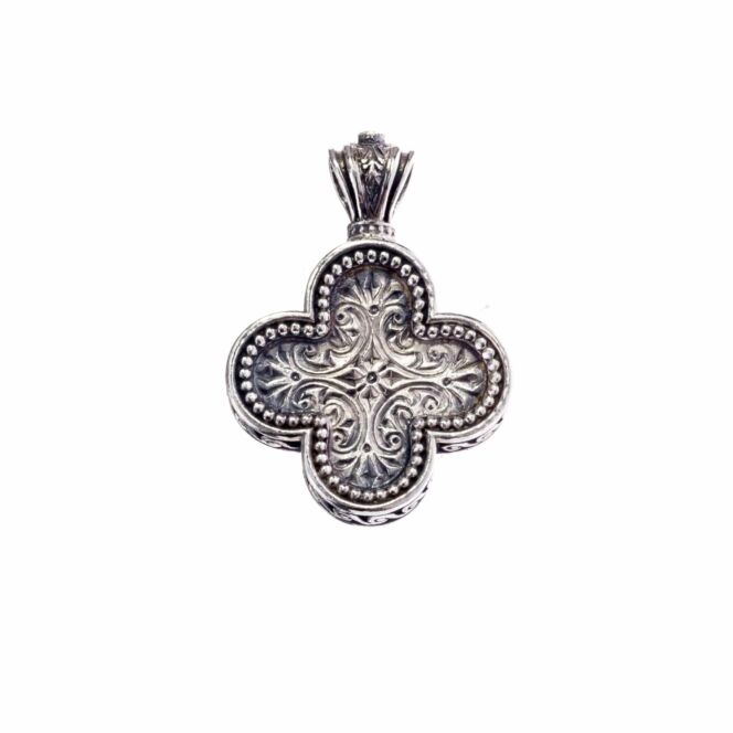 Cross in sterling silver with a tiny garnet in the top.Classic cross in Sterling Silver